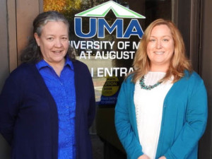 Central Region Staff Members Jean Dempster and Sherrie Brann in front of UMA door.