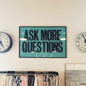 sign saying ask more questions