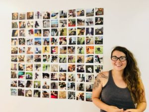 Salty dog owner standing in front of a dog photo collage