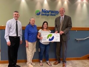 Totally Kidz owner receive grant check from Norway Savings Bank