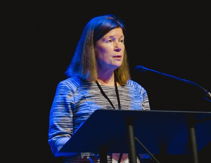 photo of Jean Grigsby speaking at conference