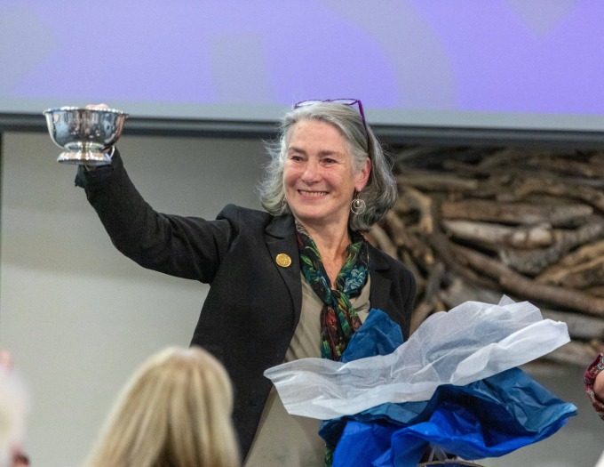 photo of Eloise Vitelli holding up award