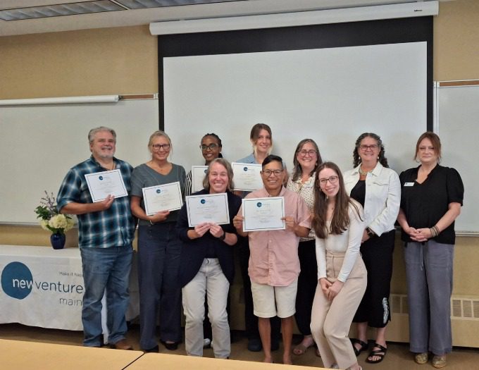 group of students with certificates and NVME instructors and speakers